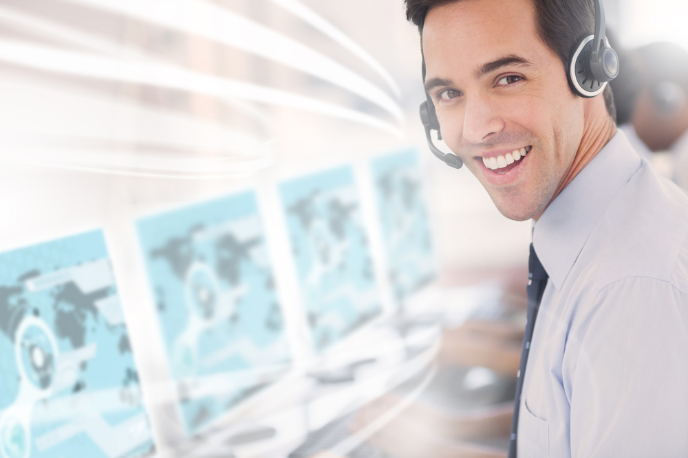 Call center worker using futuristic interface hologram smiling at camera in office